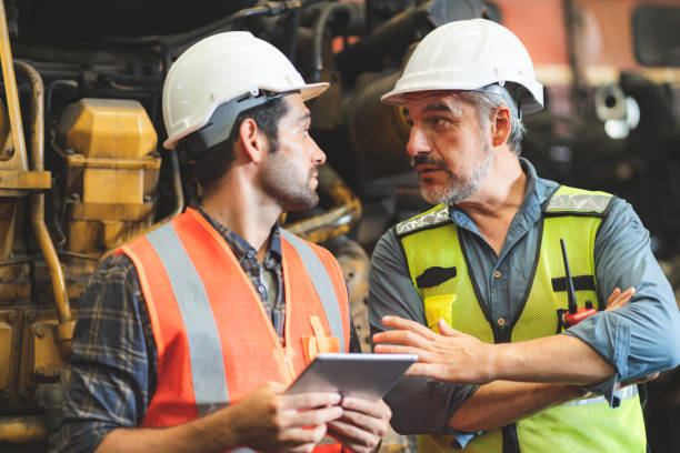 istock industrial factory with men at work concept, professional engineer foreman inspector talking in business occupation job teamwork with team, construction manager working in manufacturing technology job 1433871372