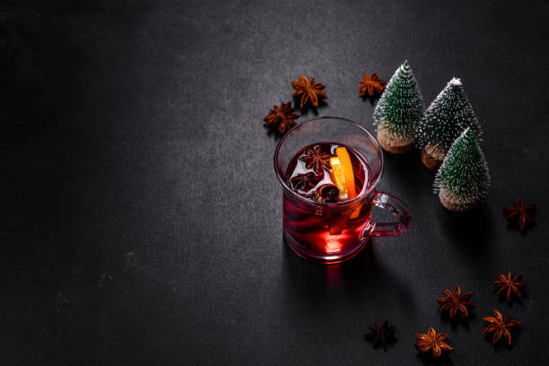 istock Christmas mulled red wine with spices and fruits on a concrete table 1433876845