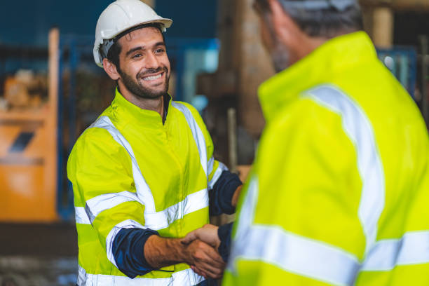 istock industrial factory with men at work concept, professional engineer foreman inspector talking in business occupation job teamwork with team, construction manager working in manufacturing technology job 1433876984