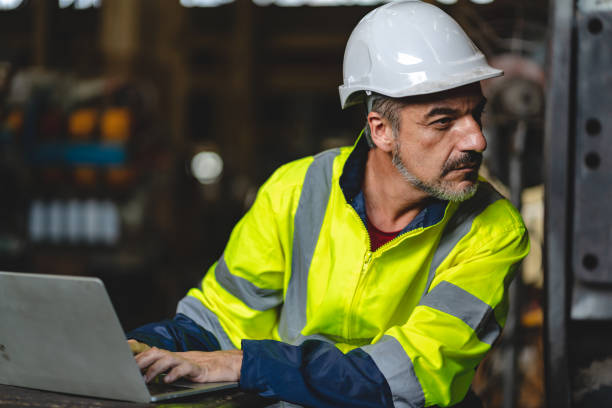 istock professional technician engineer with safety hard hat working to maintenance construction equipment in industrial factory, inspection man having manufacturing occupation job of production technology 1433878715