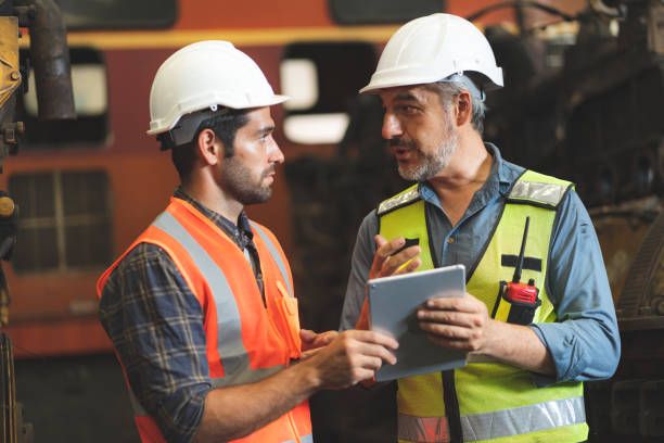 istock professional technician engineer with safety hard hat working to maintenance construction equipment in industrial factory, inspection man having manufacturing occupation job of production technology 1433879185
