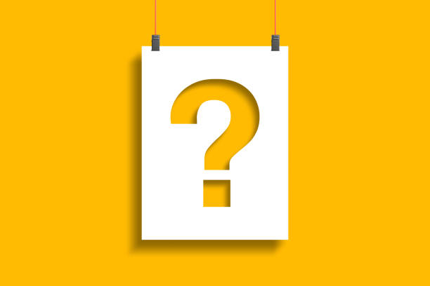 istock Question mark on paper hanging with rope on yellow background 1433879441