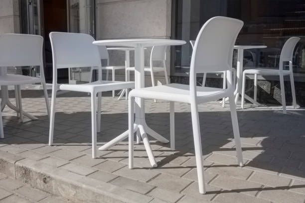 istock white plastic tables and chairs in a street cafe 1433881445