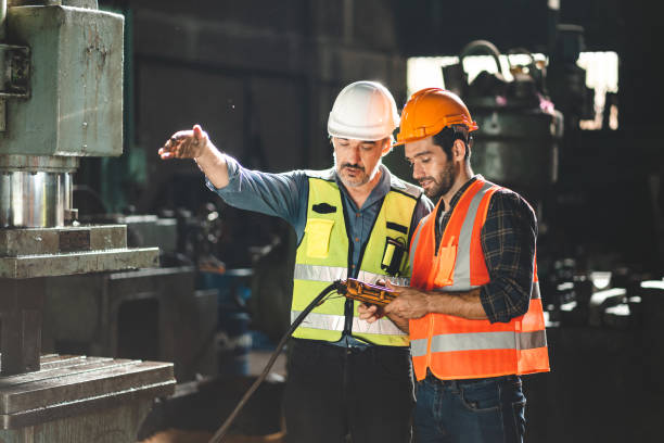 istock professional technician engineer working to check safety system of heavy industry manufacturing machine in construction plant and service a factory equipment of production job technology 1433883478