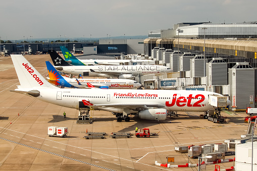 Manchester Airport, United Kingdom - 2 September, 2022: Various Aircraft parked up at Terminal 2.
