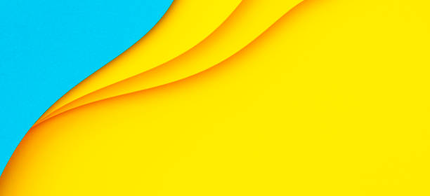 istock Abstract creative colored paper geometry composition banner background in bright yellow and light blue colors with curved lines 1433888952