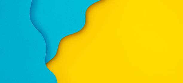 istock Abstract creative colored paper geometry composition banner background in bright yellow and light blue colors with curved lines 1433889396