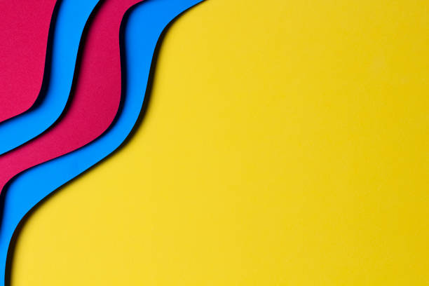 istock Abstract colored paper texture background. Minimal paper cut style composition with layers of geometric shapes and lines in red and light blue colors on yellow background. Top view 1433889429