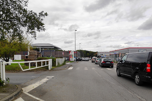 Lamorlaye, France - October 16 2022: Motorists queuing under the supervision of the Gendarmerie at a gas station due to fuel shortages linked to the oil refinery strike.