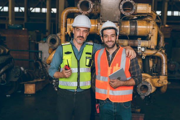 istock professional technician engineer working to check safety system of heavy industry manufacturing machine in construction plant and service a factory equipment of production job technology 1433891674