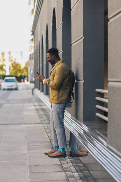 istock Young black entrepreneur waiting for his ride to work 1433893033