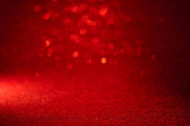 красные огни боке на фоне счастливого рождества - glitter defocused illuminated textured effect стоковые фото и изображения