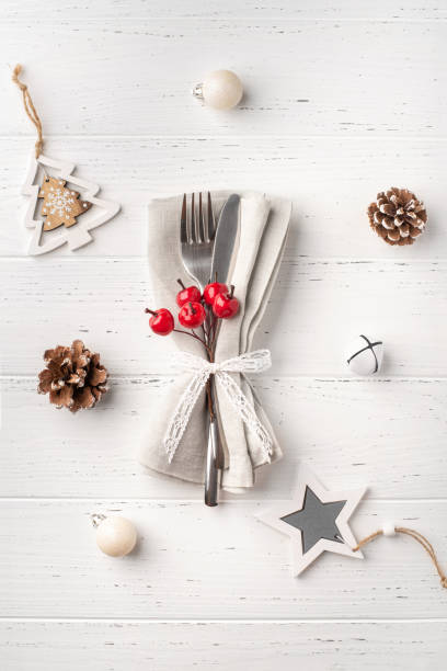 istock Christmas place setting on white wooden table. 1433894014