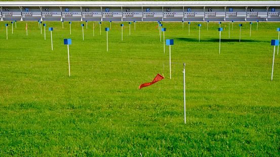 red wind direction flag biathlon shooting range. outdoor in the summer