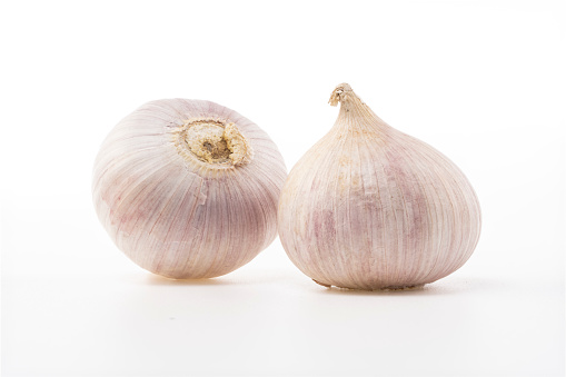 Fresh garlics isolated on white background photo.
