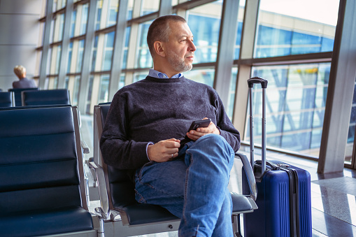 Mature man waiting for boarding