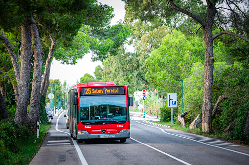 Valencia-Spain October 13/2022. Red bus from Valencia company EMT  in the road betwen the locations of El Saler and El Perelló