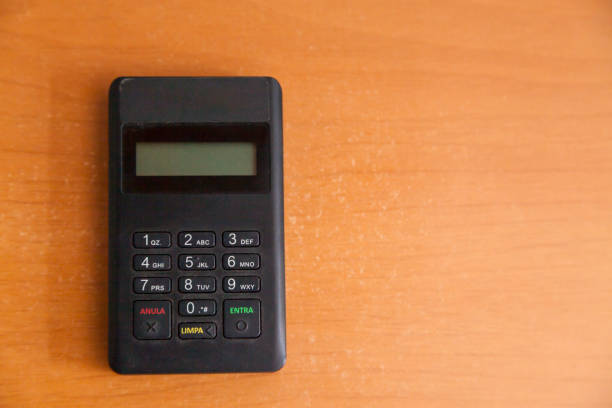 istock Inserting a card into a credit card machine. 1433900069