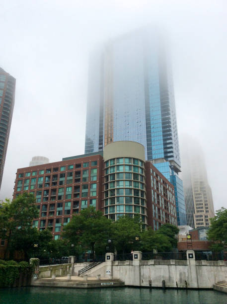 High-rise buildings on the banks of the river, city waterfront in Chicago, USA. City landscape in the fog. High-rise buildings on the banks of the river, city waterfront in Chicago, USA. City landscape in the fog. chicago smog stock pictures, royalty-free photos & images
