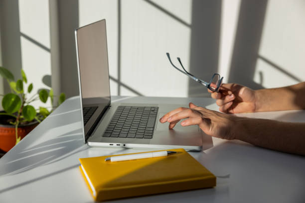 istock Side view of unrecognizable teenage boy using a laptop 1433906179
