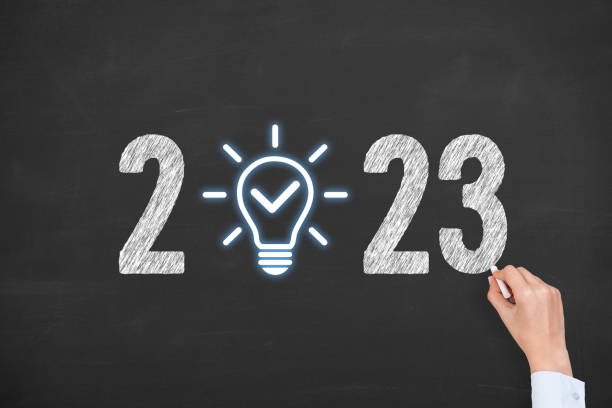 istock Human Hand Drawing New Year 2023 Idea Solution Concepts on Chalkboard Background 1433908537