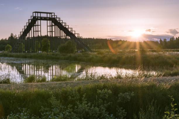 istock Observation tower with reflection on the water during sunrise 1433908560