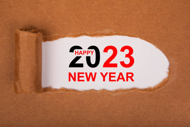 istock Torn Paper With Happy New Year 2023 On White Background 1433910124