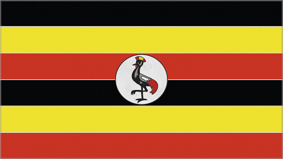 Uganda embroidery flag. Emblem stitched fabric. Embroidered coat of arms. Country symbol textile background.
