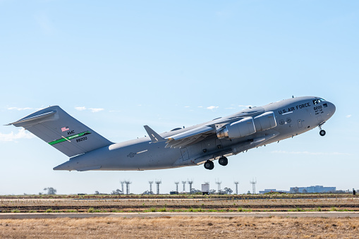 Airplane Taking off from runway preparing to climb to altitude. Photo taken in non ticket area Miramar Airbase in San Diego California USA on September 23, 2022.