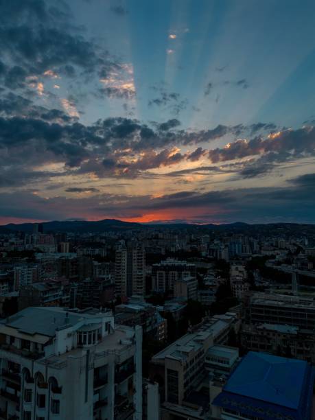 istock Mesmerizing sunset over a city surrounded by mountainous landscape, vertical 1433915505