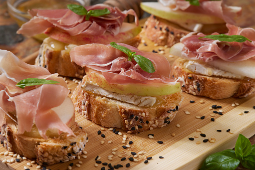 Apple and Brie Crostini with Prosciutto and Organic Honey
