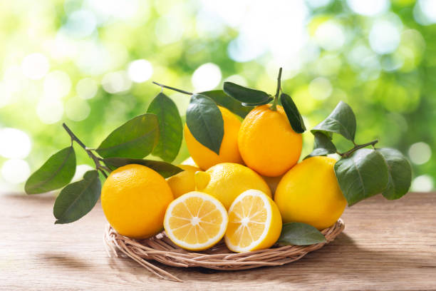 istock Fresh lemons on a wooden table 1433918378