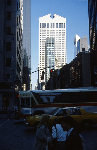 New York City, NY, USA, 1988. Street scene with pedestrians, vehicles and buildings in midtown Manhattan.