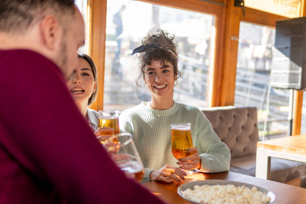 istock Friends having fun in a bar 1433921589