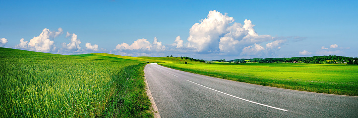 Empty asphalt road on a beautiful sunny day