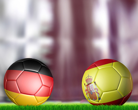 Two soccer balls in flags  Spain and Germany on stadium
