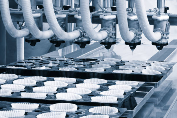 istock Sweets factory. Sweets production process. Conveyor belt with sweets 1433925667
