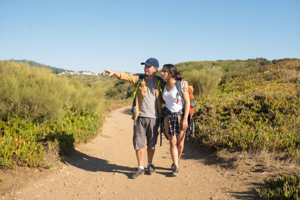 istock Backpacker pointing at view to his daughter 1433925748