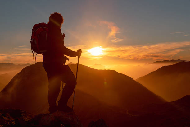 istock backlit silhouette of hiker 1433928455