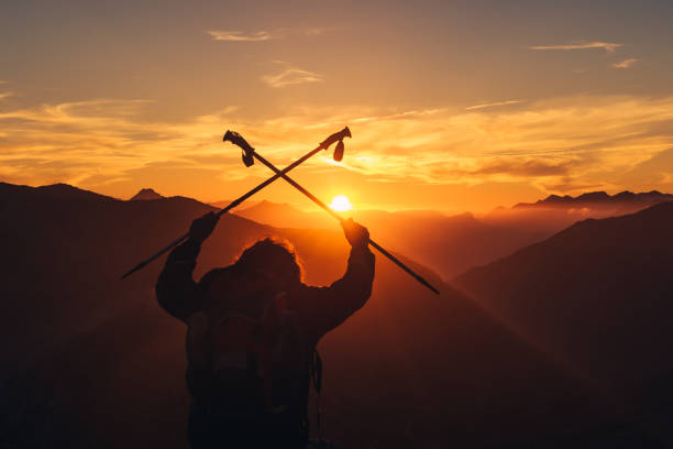 istock hiker celebrating reaching the top 1433928549