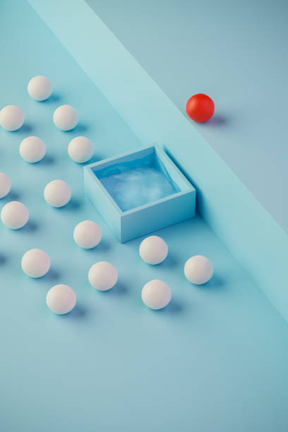Courage Concept: A group of white spheres waiting for one red sphere to jump into the pool. stock photo