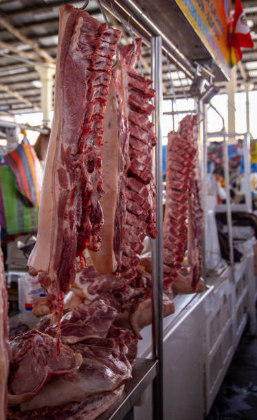 istock fresh meat hanging at a market 1433939123