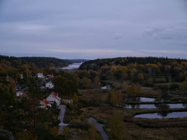 istock Scenic view over buildings and field during autumn 1433939679