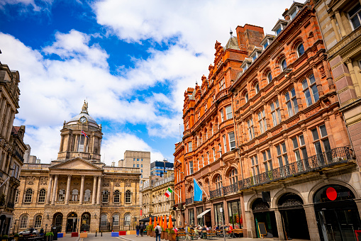 Manchester, England, UK - March 22, 2019 - Street view of Exchange Square, civic square and a major shopping area in Manchester