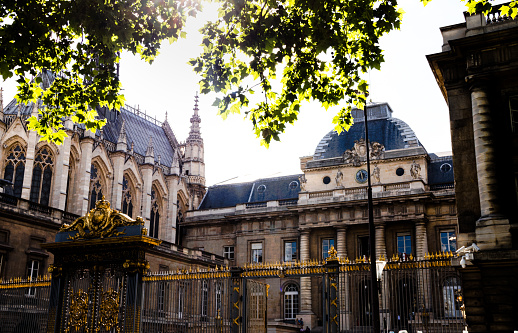 Paris, France - July 11, 2023: Crowd in the Jardin du Luxembourg with the Palais du Luxembourg.