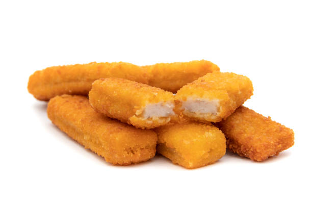istock Tasty crispy fried fish sticks (fish fingers) on white background. 1433950897
