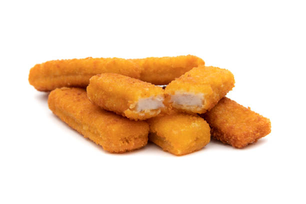 istock Tasty crispy fried fish sticks (fish fingers) on white background. 1433950904