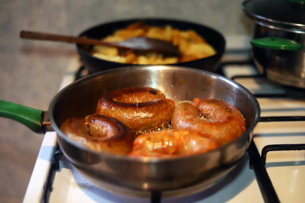 istock Frying sausages called 