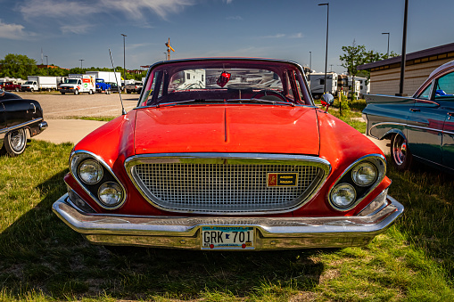 Falcon Heights, MN - June 19, 2022: High perspective front view of a 1962 Chrysler Newport 4 Door Sedan at a local car show.