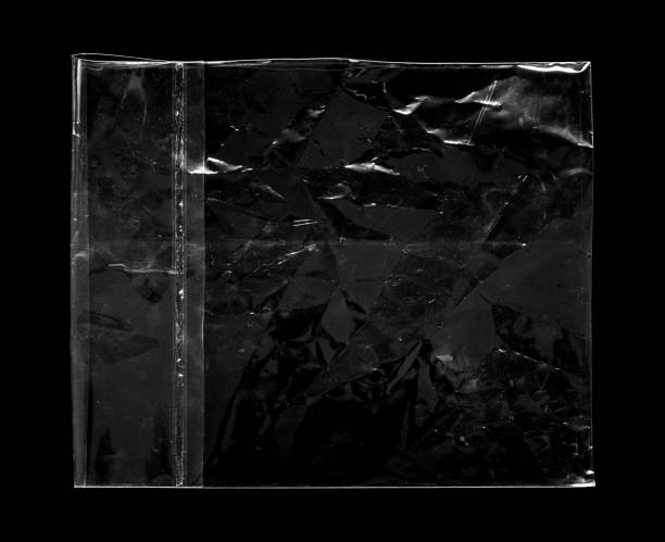 istock Blank transparent plastic bag overlay on black background 1433972206